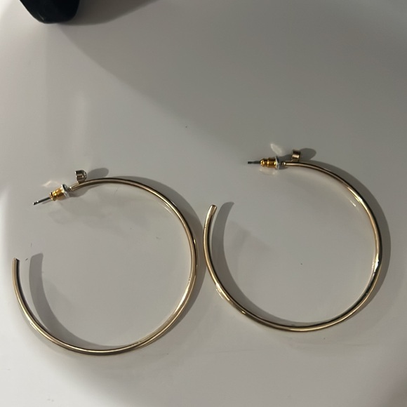 Gold tone hoop earrings with beautiful crystal accent at the top of the earrings - Picture 4 of 4